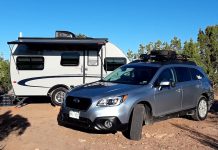 Ask: What’s Better When Towing? Heavy Truck or a Light Crossover? Subaru Outback towing a camping trailer rv cross country
