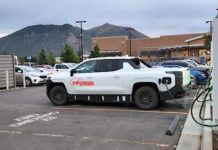 Spied: 2024 Chevy Silverado EV Prototype Is Caught Charging at a Walmart 2024 chevy silverado ev prototype walmart ea charger